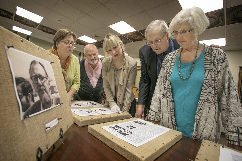 Stony Brook, NY; Stony Brook University: Paul and Martha Siegel stand near a display of their late father Ronald. The Siegel's created the Dorothy J. and Ronald W. Siegel Rare Book Endowment to benefit Stony Brook University Libraries. Pictured L-R: Martha Siegel, Dennis Mynarcik, Kristen Nyitray, Paul Siegel, and Suzanne Siegel