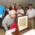 Attendees viewing 1779 letter. Washington lecture and letter viewing, Neighborhood House, Setauket, July 16, 2018. Photo credit: Beverly C. Tyler.