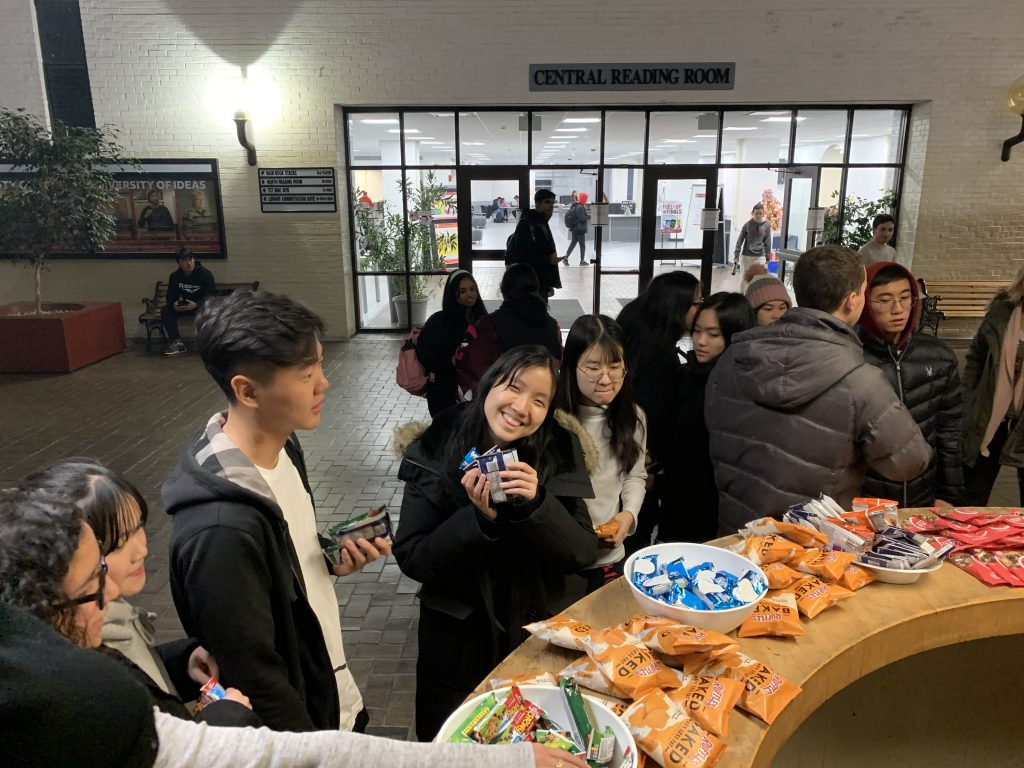 student smiling with snacks