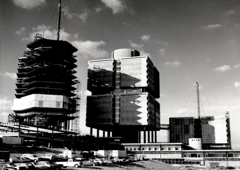 The towers of the Health Sciences Center complex were completed in three phases between 1976 and 1980. Pictured left to right: University Hospital (1980), Clinical Sciences Tower (completed 1976), and Basic Health Sciences Research Tower (1978). 
Source: University Archives.