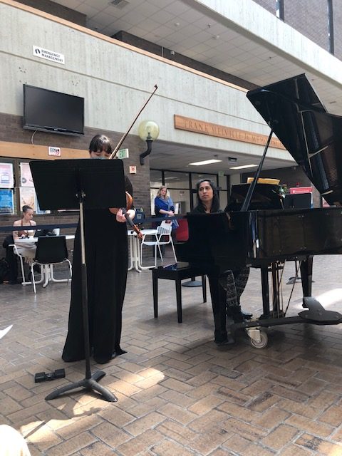 violinist and accompanist performing in Galleria