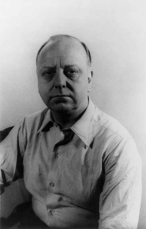 Black and white photograph of Virgil Thomson form waist up, looking at camera.