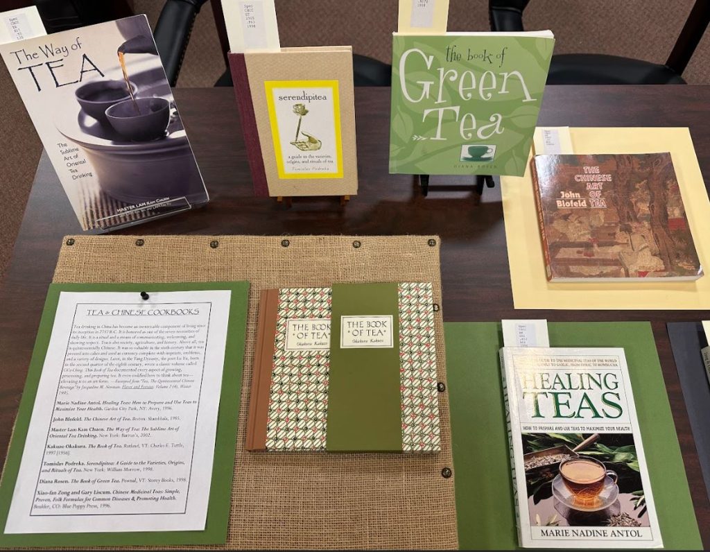 Photograph of six books about Chinese tea. Taken at the Art Crawl in Special Collections, Melville Library, Stony Brook University on April 26, 2023.