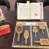 Photograph of four books about Chinese desserts and six mooncake molds. Taken at the Art Crawl in Special Collections. Melville Library, Stony Brook University on April 26, 2023.