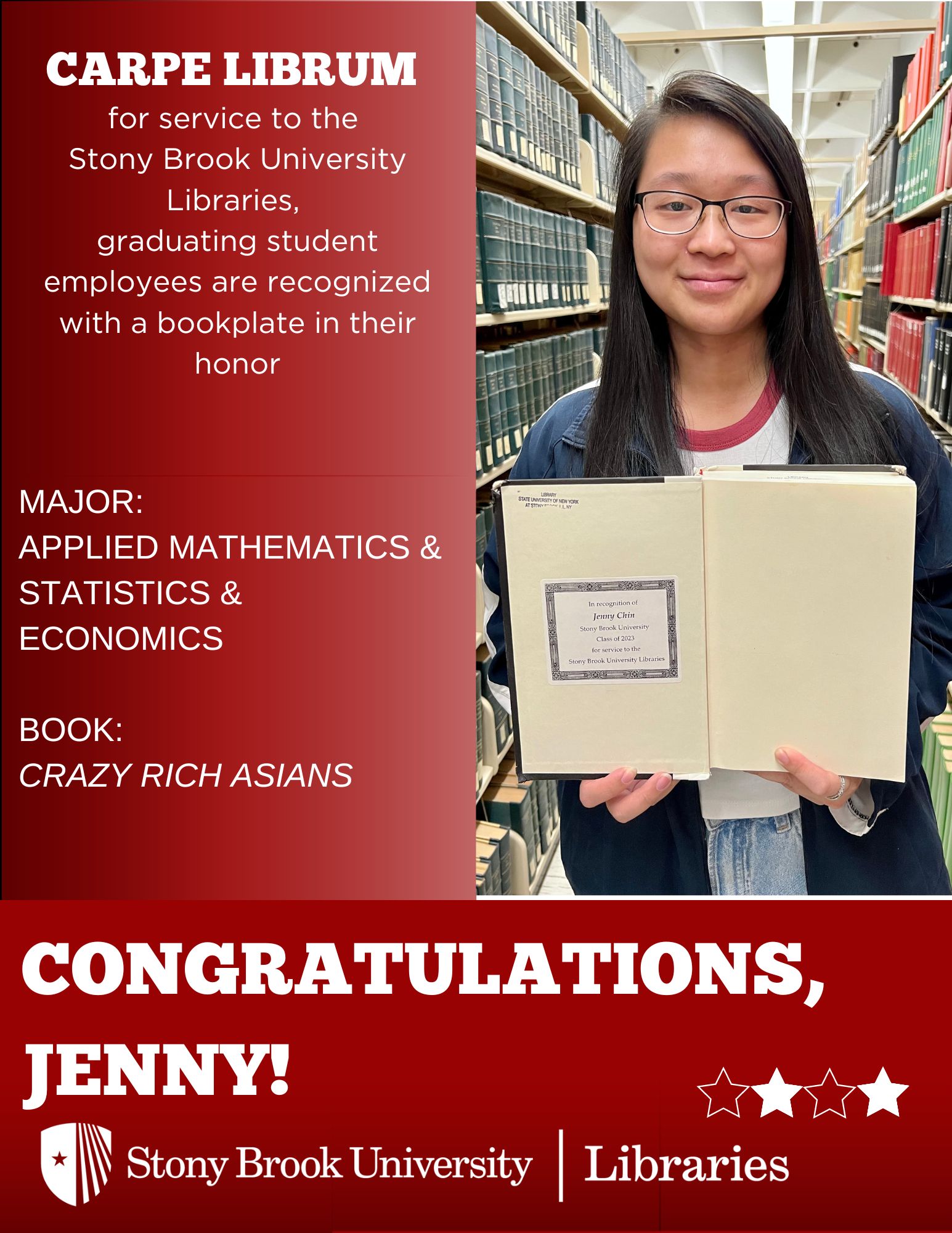 Student holding a book in front of library stacks