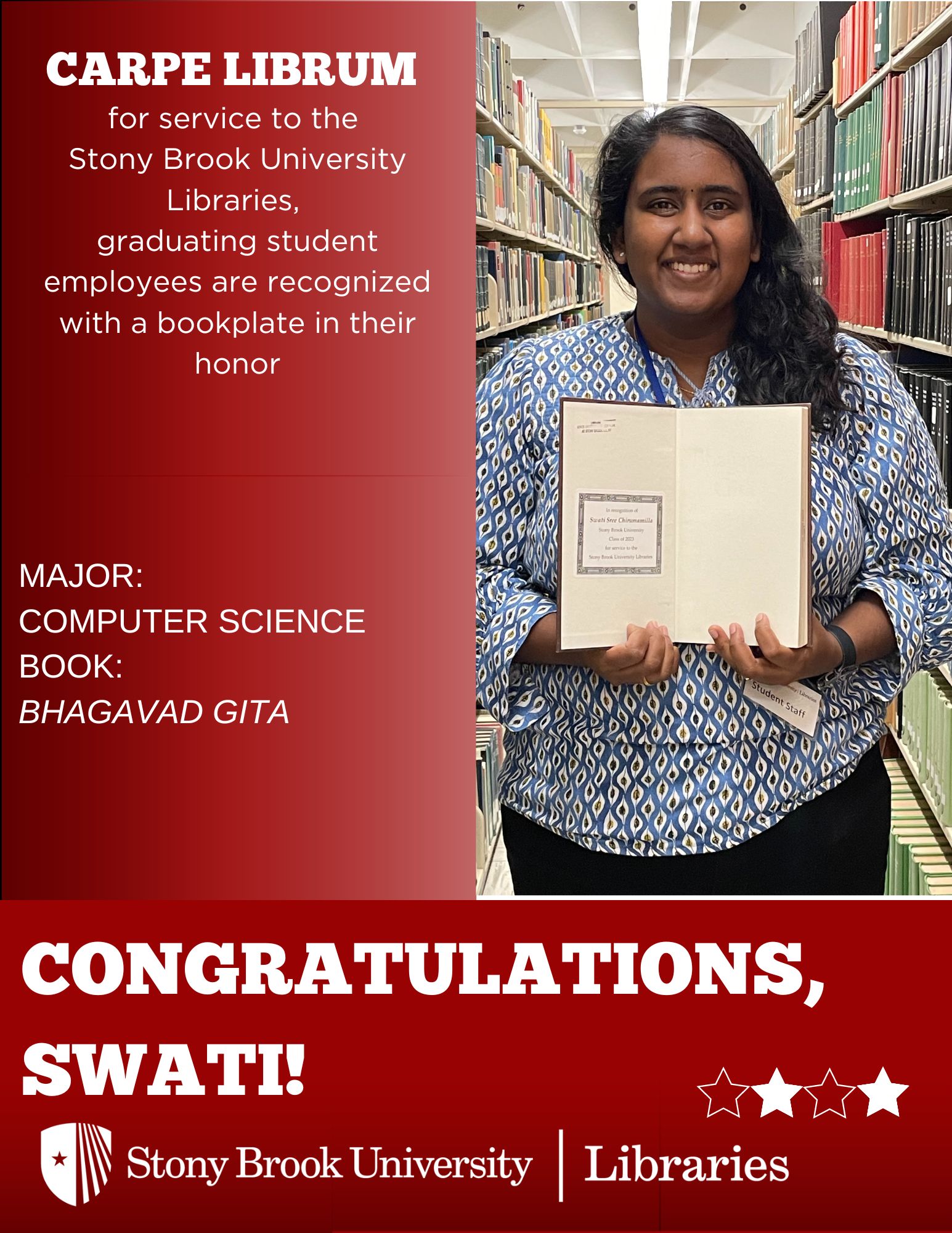 Student holding a book in front of library stacks