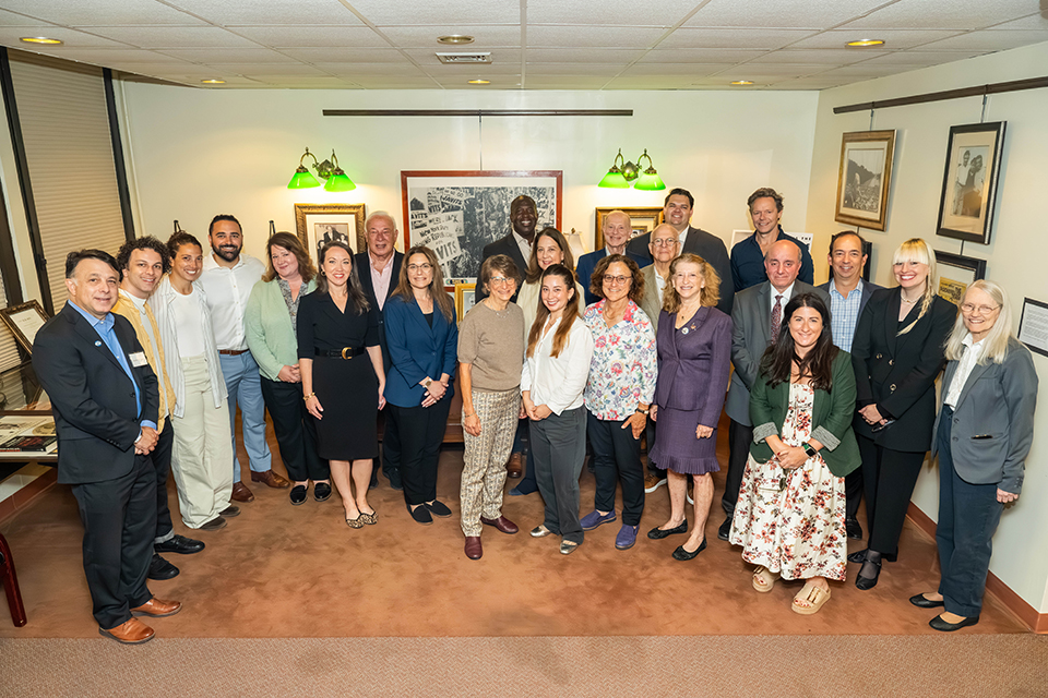Event attendees, including the Javits family, Javits Foundation Board members, and representatives from the University Libraries, gathered beside an exhibition of Senator Javits’ archive in the Melville Library. Photo credit: Kristy Leibowitz, Stony Brook University