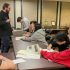 Students in Professor Sam Dodd's course ARH 400 consulting the Robert M. Emery Long Island Rail Road Collection in Special Collections, Stony Brook University Libraries, October 2025.