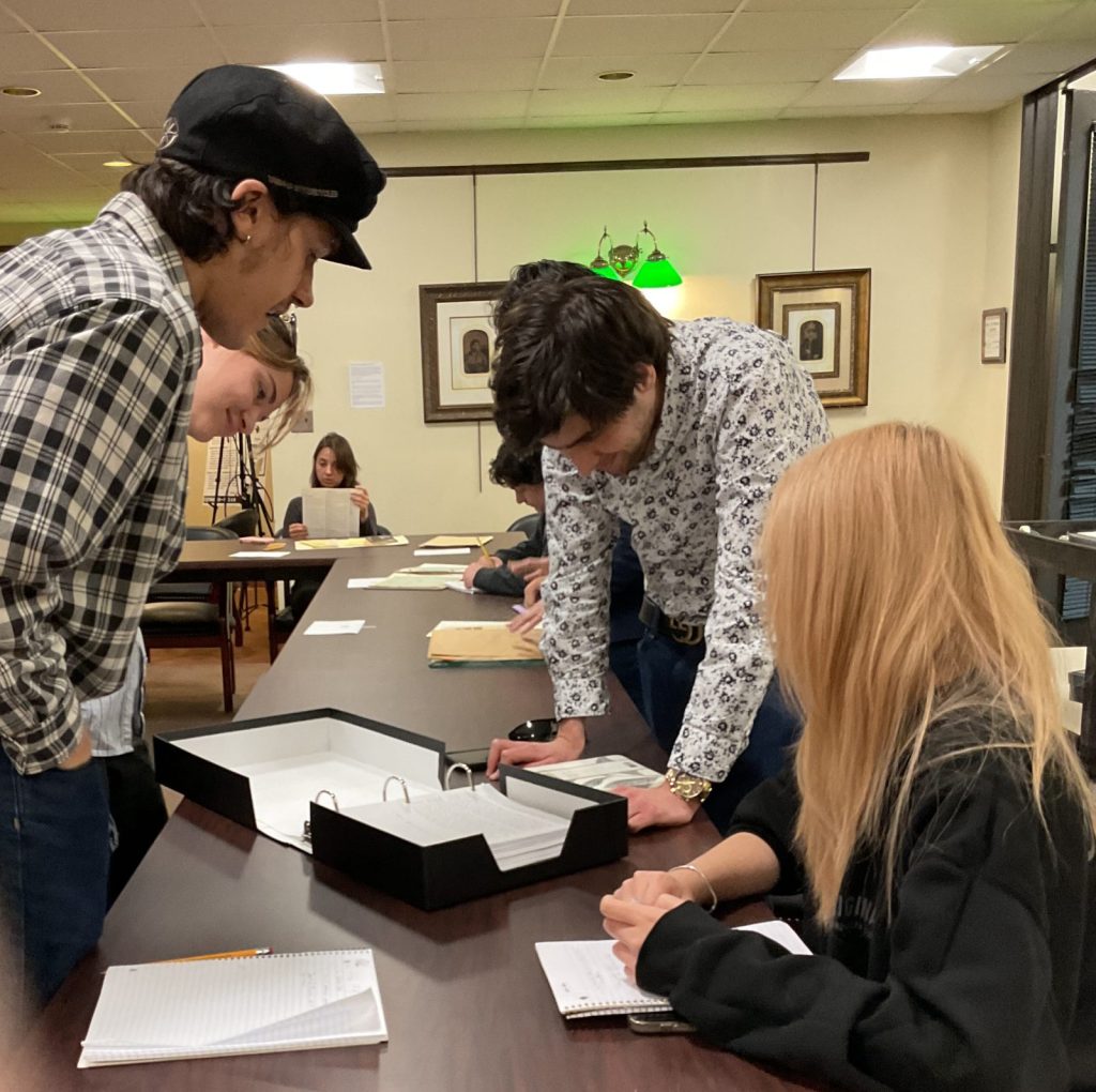 Students in Professor Sam Dodd's course ARH 400 consulting the Robert M. Emery Long Island Rail Road Collection in Special Collections, Stony Brook University Libraries, October 2025.