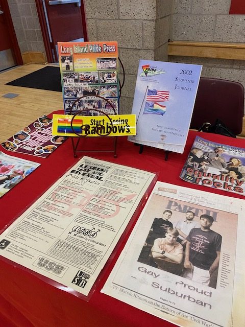 Archival materials on display from the University Archives and the Long Island Pride Parade, Inc. Collection from Special Collections, Stony Brook University Libraries.