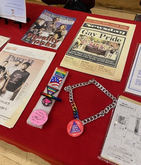 Archival materials on display from the University Archives and the Long Island Pride Parade, Inc. Collection from Special Collections, Stony Brook University Libraries.