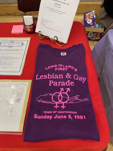 Archival materials on display from the University Archives and the Long Island Pride Parade, Inc. Collection from Special Collections, Stony Brook University Libraries.