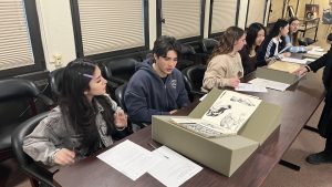 Students looking at different materials.