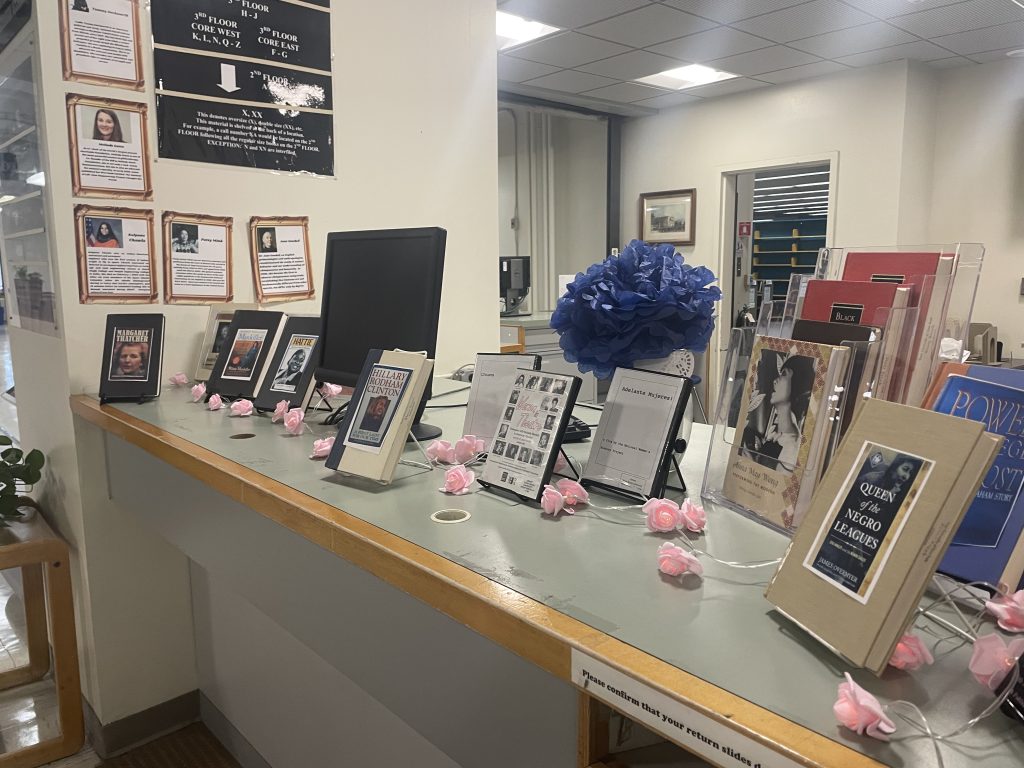 Photo of a countertop with books and posters on display.