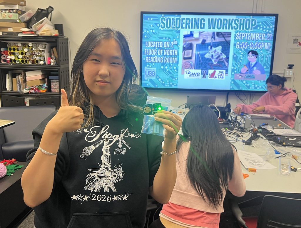 proud student shows their successful soldering project